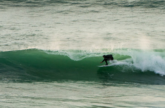 Surfer is barrelled at Watergate Bay